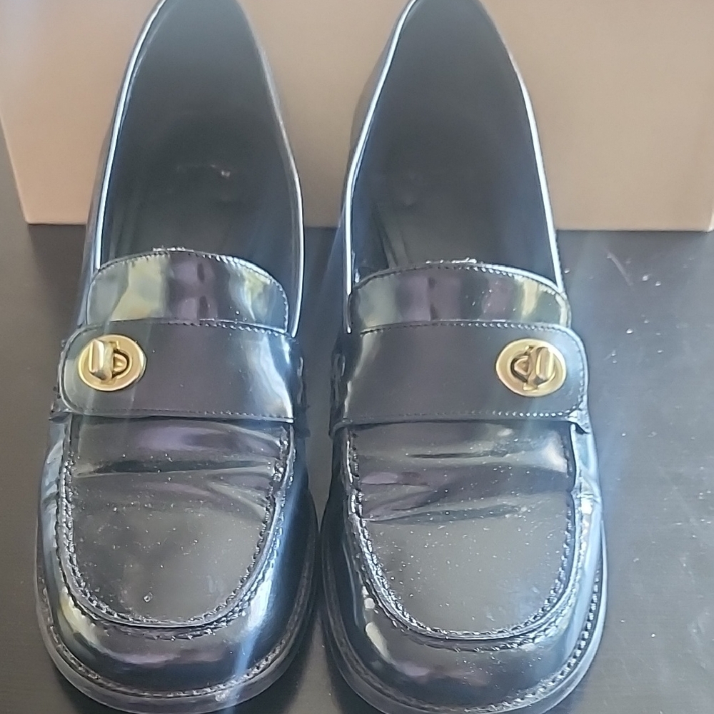 Coach Elegant Black Loafers with Gold Accent
